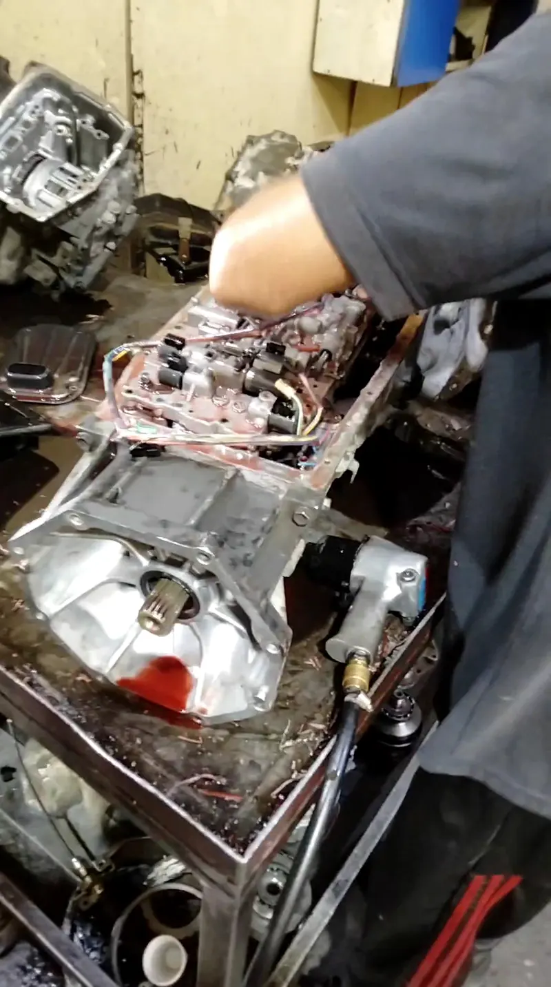 Car parts laid out on the workbench during a repair